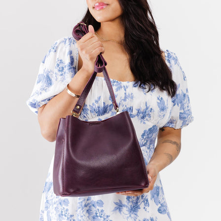  Plum | symmetrical bucket bag with latch closure and removable crossbody strap