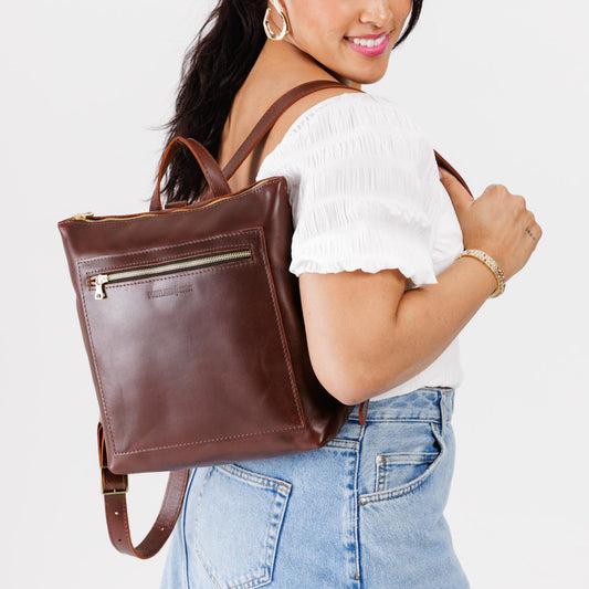 All Color: Cognac | Model wearing square slim leather tote backpack