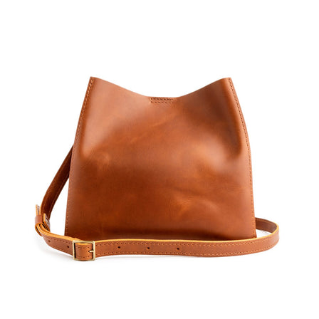  Honey | symmetrical bucket bag with latch closure and removable crossbody strap